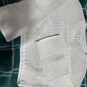 Cropped sweater size S. The sweater has a slight bell sleeve.
